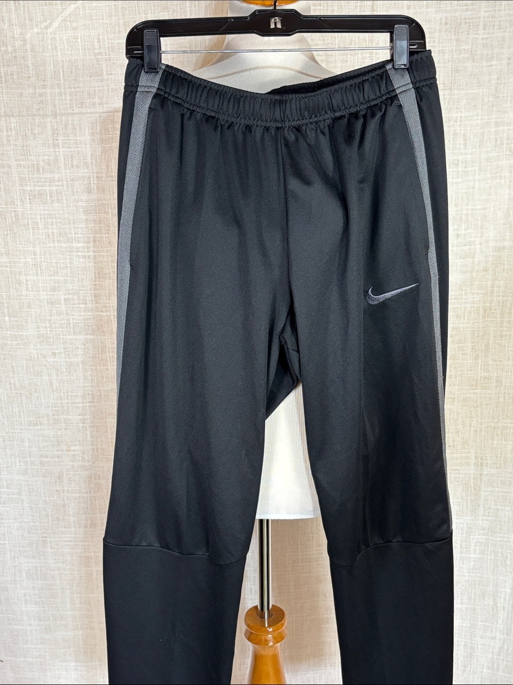 NWOT Nike warmup pants - black with gunmetal stripes and swoosh